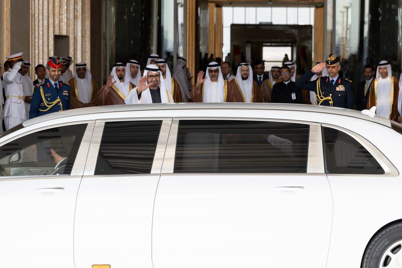 Sheikh Mohamed waves Mr Modi's car off as his official guest is driven away. Mohamed Al Hammadi / Presidential Court