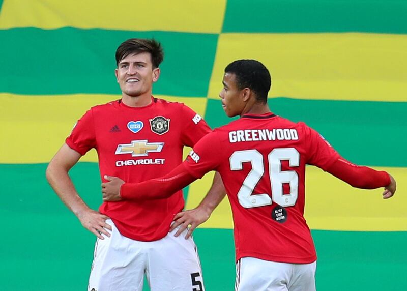 Manchester United's Harry Maguire, left, celebrates scoring the winner in their extra-time victory against Norwich City in the FA Cup quarter-final clash at Carrow Road on Sunday, June 27. Reuters