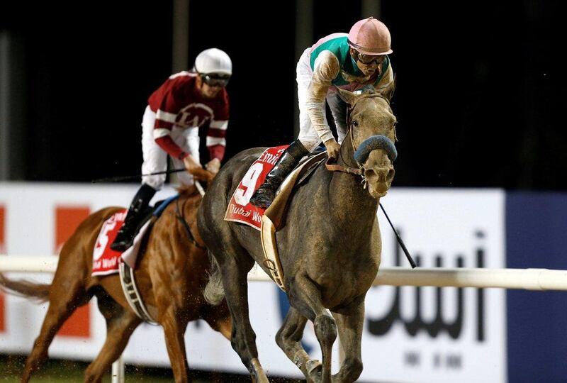 Mike Smith rides Arrogate to the finish line, beating Gun Runner (in the background) who came in second. Ahmed Jadallah / Reuters