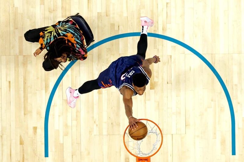 New York Knicks forward Dennis Smith Jr dunks over recording artist J Cole in the Slam Dunk Contest during the NBA All-Star Saturday Night at Spectrum Center. Mandatory Credit: Chuck Burton / Pool photo-USA TODAY Sports