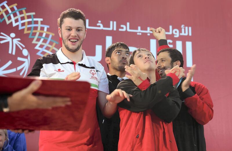 DUBAI , UNITED ARAB EMIRATES , March 20 – 2019 :- Left to Right - Khalid Albarguthi  , Abdullah Al Tajer , Omer Alshami and Awadh Alketbi during the victory ceremony of the 4x50m freestyle relay at the Special Olympic games held at Hamdan Sports Complex in Dubai. UAE won the bronze.  ( Pawan Singh / The National ) For News/Instagram/Online/Big Picture . Story by Ramola