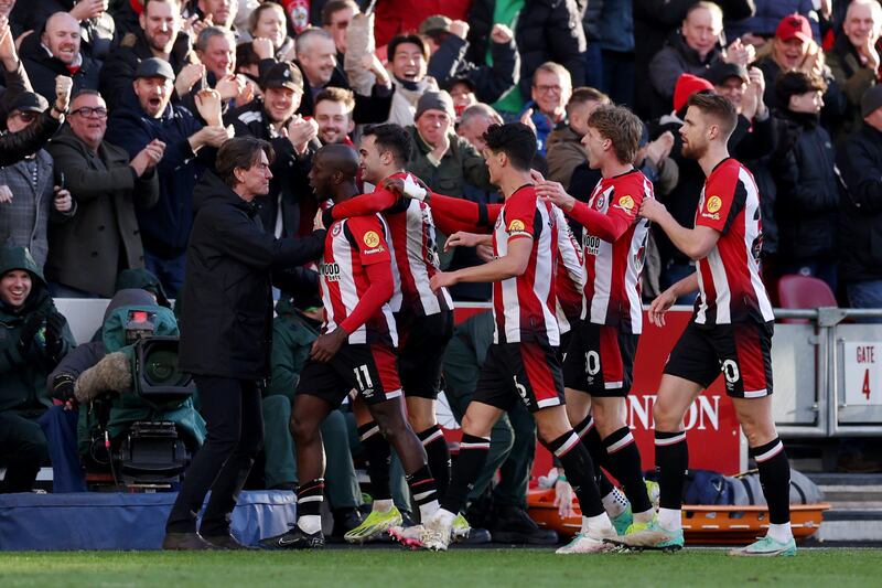 Yoane Wissa of Brentford celebrates with teammates and manager Thomas Frank after scoring his team's second goal. Getty Images