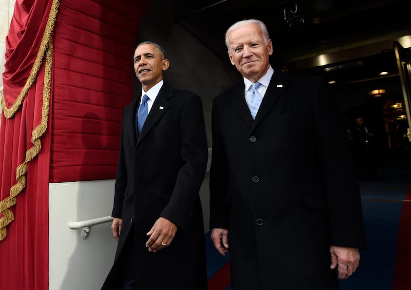 FILE - In this Jan. 20, 2017, file photo, President Barack Obama and Vice President Joe Biden arrive for the Presidential Inauguration of Donald Trump at the U.S. Capitol in Washington. 2020 presidential candidate and former Vice President Biden is releasing a video of his first in-person meeting with former President Obama since the coronavirus outbreak began, enlisting the former president to help slam his successor's response to the pandemic. (Saul Loeb/Pool Photo via AP, File)