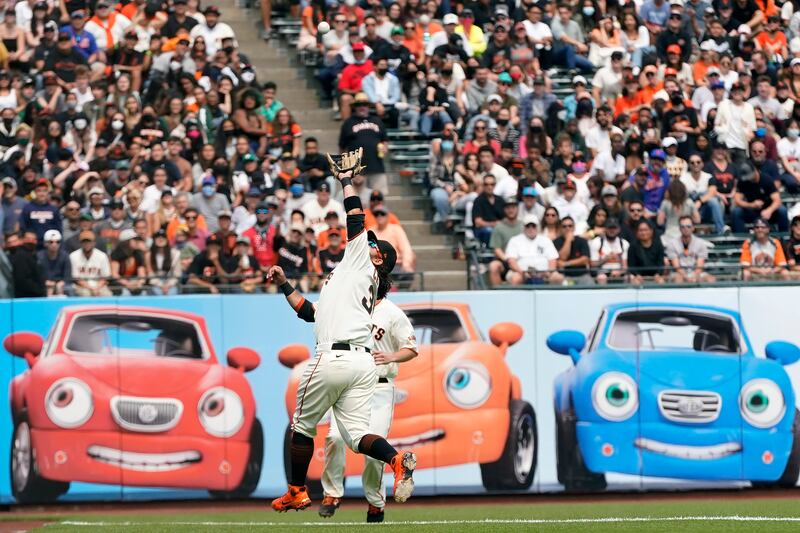 San Francisco Giants' Brandon Crawford catches a fly out hit by Patrick Mazeika of the New York Mets in the MLB game in San Francisco, on Wednesday, August  18. AP