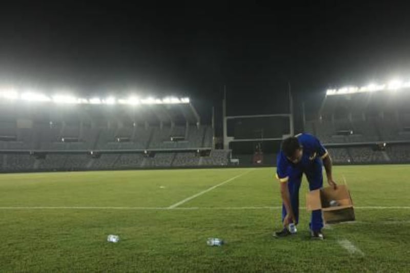 07OCT2010-ABU DHABI- Mohammed Noursal cleans the ground at Zayed sports city after every match in Abu Dhabi. Ravindranath.K / The National