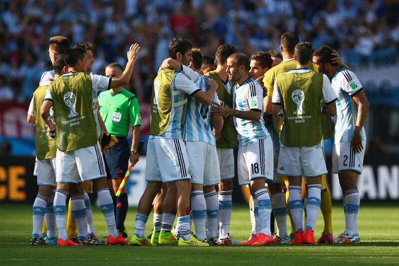 Lionel Messi of Argentina celebrates with teammates after scoring his team's winner in a 1-0 victory over Iran on Saturday at the 2014 World Cup in Belo Horizonte, Brazil. Quinn Rooney / Getty Images