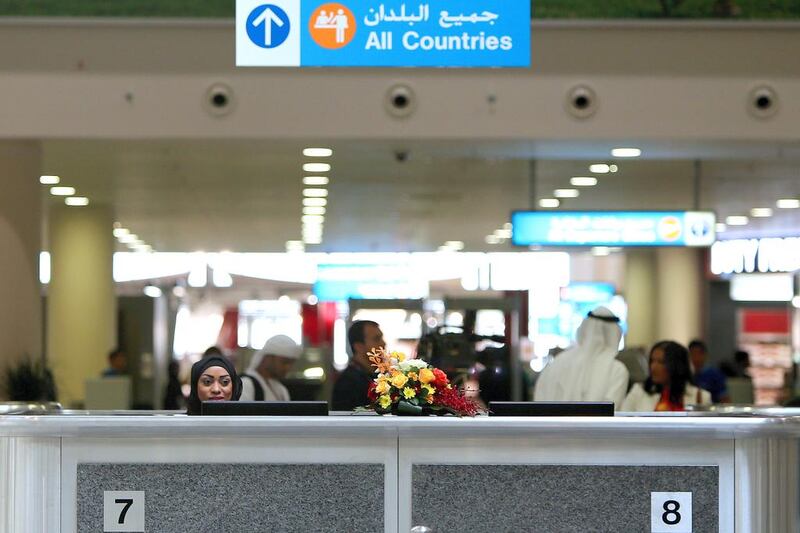 All residents seeking a new work visa from February 4 will need to secure a Good Conduct and Behaviour Certificate.. Pictured, people pass through security at Al Maktoum International airport in Dubai.  Marwan Naamani / AFP
