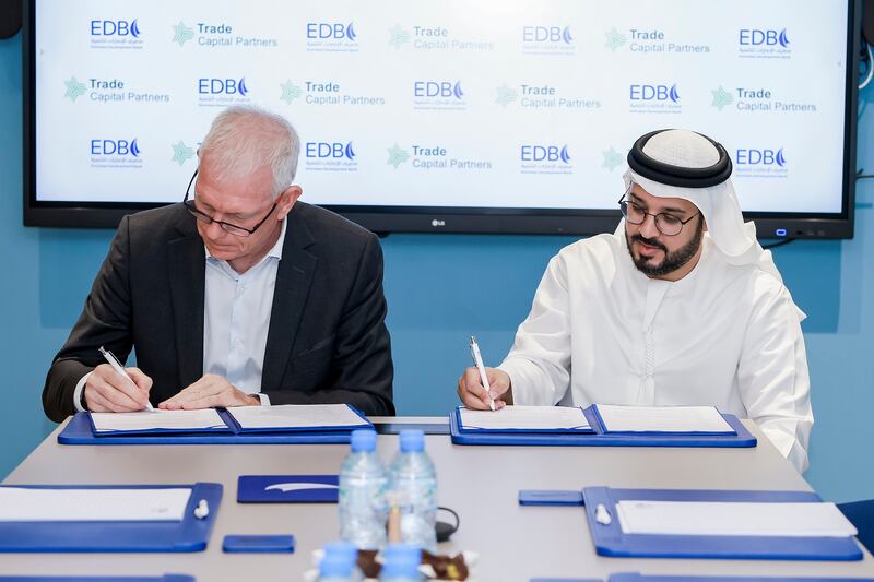 Ahmed Al Naqbi, chief executive of EDB, right, and Bill Crawley, founder and chief operating officer of TCP, signed the agreement. Photo: EDB