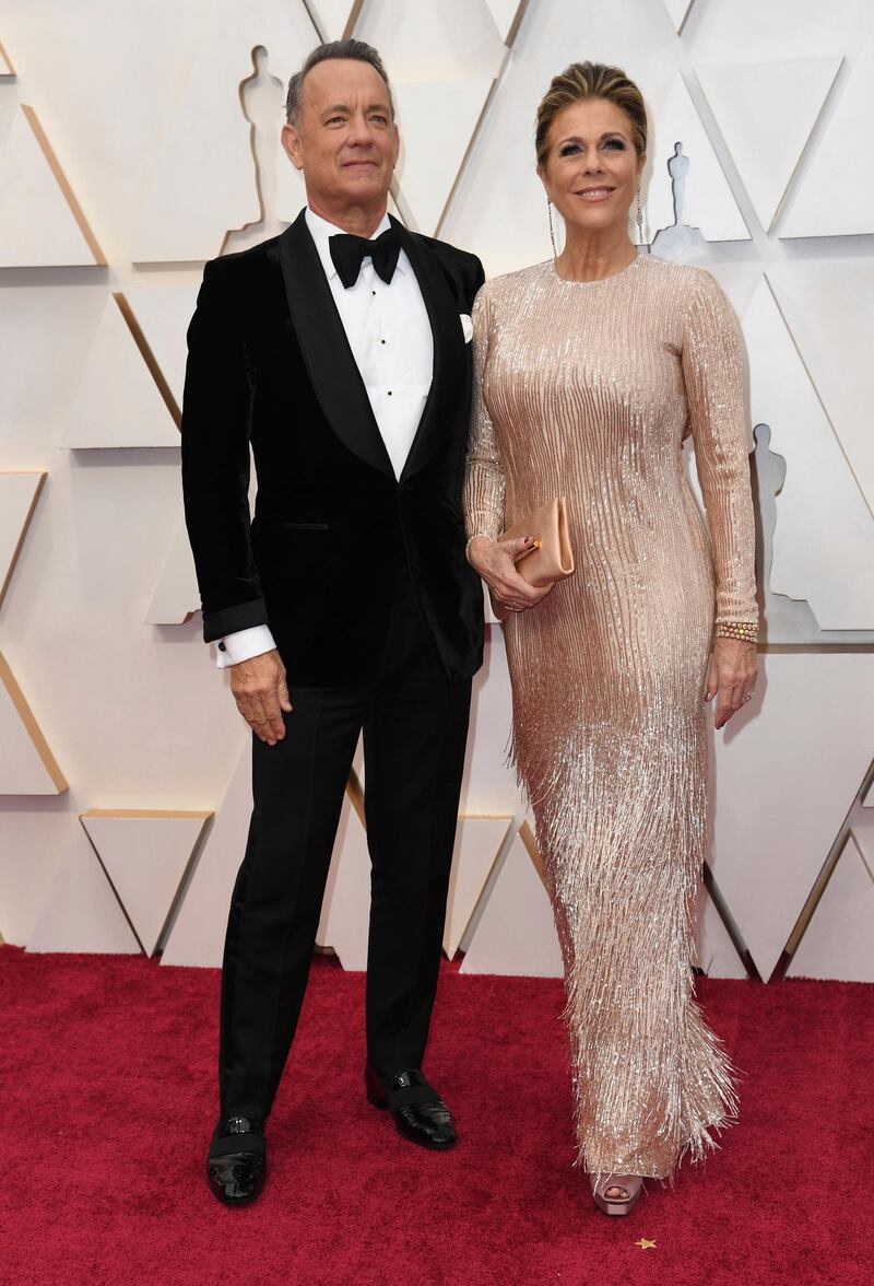 Tom Hanks, wearing Tom Ford, and Rita Wilson arrive at the Oscars on Sunday, February 9, 2020, at the Dolby Theatre in Los Angeles. AP