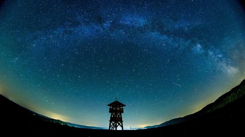 A picture taken with a wide-angle lens shows the Milky Way observed in the background of a lookout tower near the Hungarian border village of Tachty, or Tajti in Hungarian, Slovakia. Peter Komka / EPA