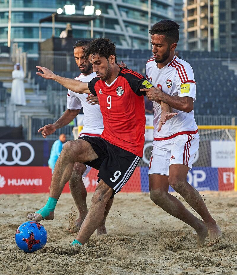 Dubai,  United Arab Emirates - November, 01                             Huawei Intercontinental Beach soccer Cup Dubai 2017 at Marasi Business Bay  on November 01, 2017 in Dubai,  United Arab Emirates. Egypt’s Hatem Atef is challenged by two UAE players in the Intercontinental Cup beach soccer tournament at the Marasi Business Bay in Dubai on Wednesday, November 1, 2017. (Lea Weil - beachsoccer.com)