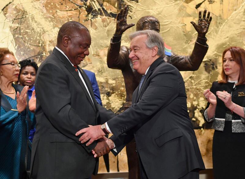 South Africa President Cyril Ramaphosa, left, and United Nations Secretary General Antonio Guterres shake hands after the unveiling ceremony of the Nelson Mandela Statue which was presented as a gift from South Africa, Monday, Sept. 24, 2018, at United Nations headquarters. (Angela Weiss/Pool Photo via AP)