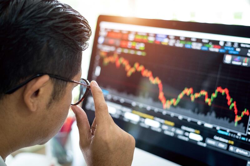 businessman analysis stock market . Getty Images