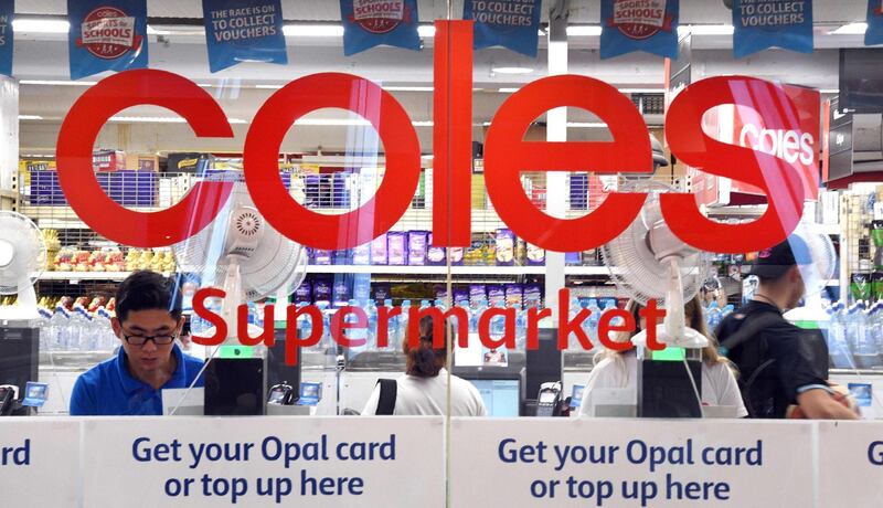 People are shopping at a Coles supermarket in the central business district of Sydney. William WEST / AFP
