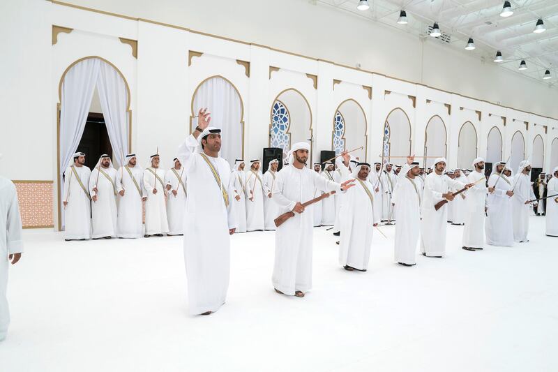 ADHAN, RAS AL KHAIMAH, UNITED ARAB EMIRATES - March 13, 2018: A traditional dance is performed during a mass wedding reception for HH Sheikh Mohamed bin Saud bin Saqr Al Qasimi, Crown Prince and Deputy Ruler of Ras Al Khaimah (not shown), at Mohamed bin Zayed, Al Bayt Mitwahid wedding hall. 

( Mohamed Al Hammadi / Crown Prince Court - Abu Dhabi )
---