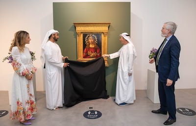 From left, Katia Nounou, head of Sotheby's UAE; Sheikh Zayed bin Sultan bin Khalifa Al Nahyan; Zaki Nusseibeh, cultural adviser to the President of the UAE and chancellor of UAEU; and Christopher Apostle, Sotheby's head of Old Master Paintings in New York, at the unveiling and exhibit of Sandro Botticelli's 'The Man of Sorrows' at Sotheby's Dubai in DIFC. Ryan Lim for The National