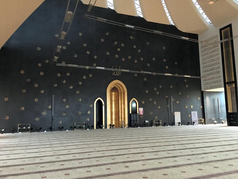The Qibla wall of Sheikha Fatima bint Mubarak Mosque, in Mohamed bin Zayed city, is painted with the 99 names of Allah.