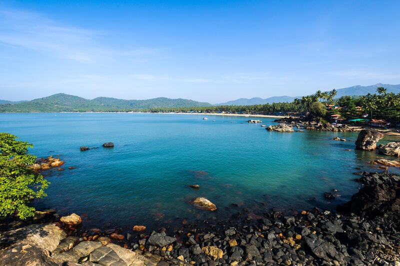 PALOLEM, GOA, INDIA - 2013/12/14: Palolem Beach with blue sky, palm trees, white sand and blue sea is one of the famous beaches in the former Portuguese colony Goa. (Photo by Frank Bienewald/LightRocket via Getty Images)