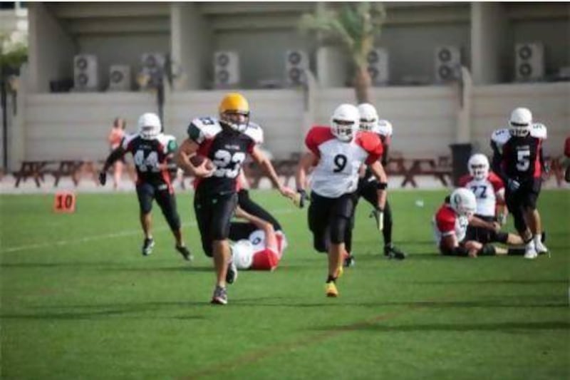 The UAE Falcons, in black, have been recognised as the UAE's national American football team.