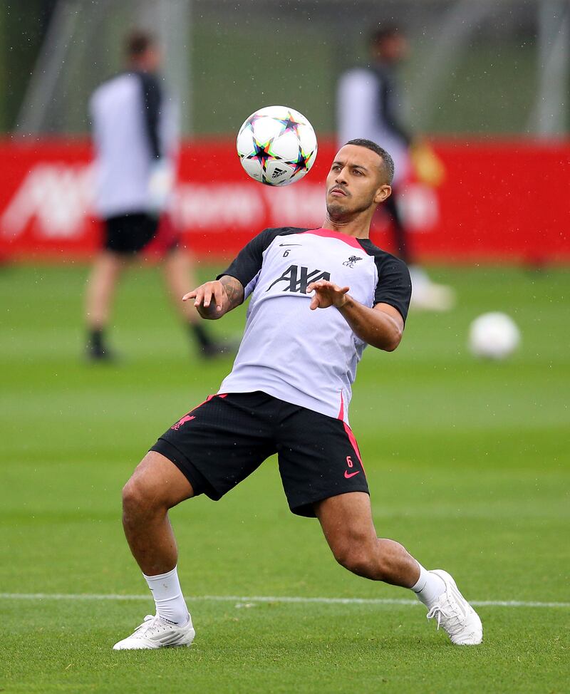 Liverpool's Thiago Alcantara controls the ball during training. PA