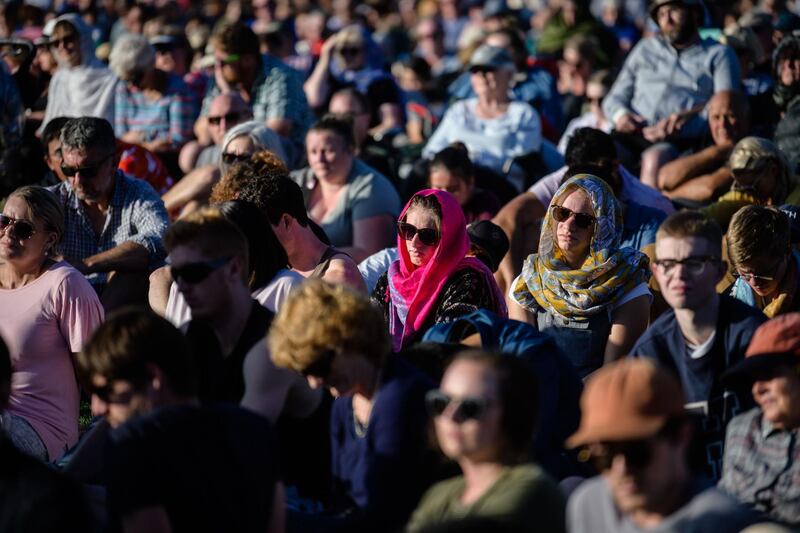 People attend a vigil in memory of the twin mosque massacre victims in Christchurch on March 24, 2019. New Zealand will hold a national remembrance service for victims of the Christchurch massacre on March 29, the government announced, as the country grieves over a tragedy that shocked the world. / AFP / Anthony WALLACE
