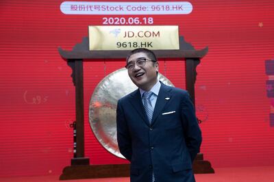Xu Lei, head of JD Retail, reacts before the ceremony to mark the listing of JD.com on the Hong Kong Stock Exchange at the JD.com headquarters in Beijing on Thursday, June 18, 2020. Chinese e-commerce firm JD.com's stock jumped nearly 6% on its debut in Hong Kong on Thursday after the firm raised $3.9 billion in a share sale. (AP Photo/Ng Han Guan)