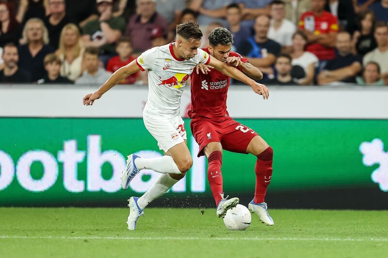 Amar Dedic of Red Bull Salzburg and Luis Diaz of Liverpool battle for the ball. Getty