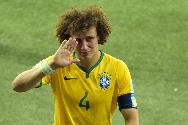 David Luiz waves a tearful good-bye as he walks off the pitch following Brazil's 7-1 loss to Germany in the 2014 World Cup semi-finals on Tuesday in Belo Horizonte, Brazil. Gabriel Bouys / AFP / July 8, 2014