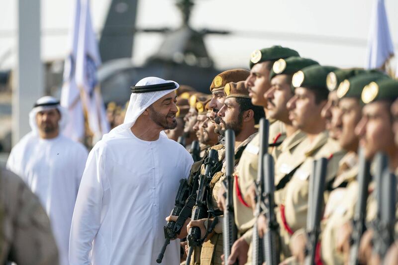 SWEIHAN, ABU DHABI, UNITED ARAB EMIRATES - February 09, 2020: HH Sheikh Mohamed bin Zayed Al Nahyan, Crown Prince of Abu Dhabi and Deputy Supreme Commander of the UAE Armed Forces (C), inspects military personnel during a reception at Zayed Military City to celebrate and honor members of the UAE Armed Forces who participated in the Arab coalition in Yemen. 
( Ryan Carter / Ministry of Presidential Affairs )
---