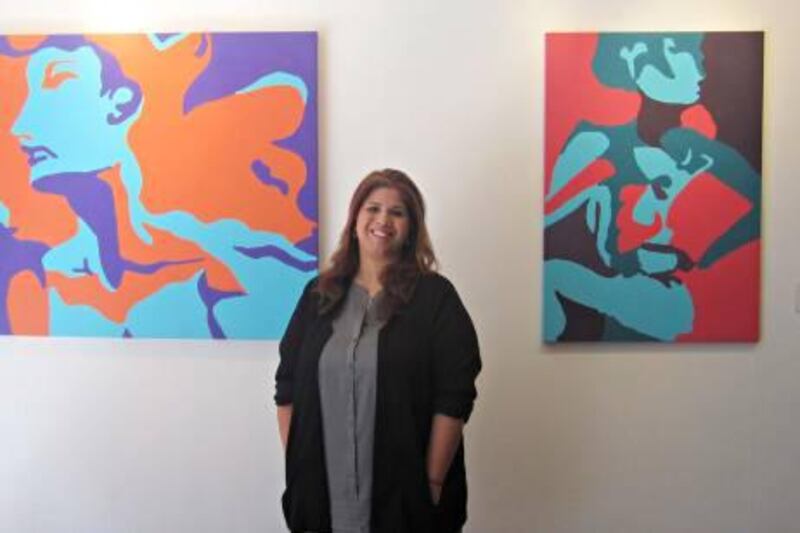 Noor Al Suwaidi pictured with her work.

Courtesy Newertown Art