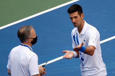 epa08651695 Novak Djokovic of Serbia (R) talks to Head of Officiating at International Tennis Federation (ITF) Soeren Friemel after he accidentally hit a linesperson with a ball in the throat during his match against Pablo Carreno Busta of Spain on the seventh day of the US Open Tennis Championships at the USTA National Tennis Center in Flushing Meadows, New York, USA, 06 September 2020. Djokovic was defaulted from tournament. Due to the coronavirus pandemic, the US Open is being played without fans and runs from 31 August through 13 September. EPA/JASON SZENES