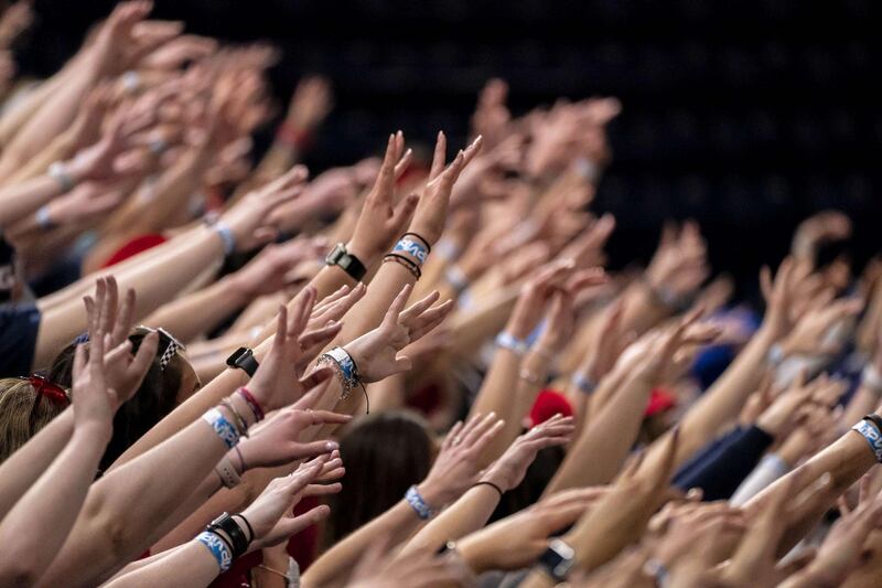 SPOKANE, WA - APRIL 05: Gonzaga University students hold their arms in the air during a watch party at the McCarthey Athletic Center at Gonzaga University on April 5, 2021 in Spokane, Washington. Students were allowed to support the Gonzaga Bulldogs they competed against the Baylor Bears in the National Championship game of the 2021 NCAA Men's Basketball Tournament, attempting to continue their unbeaten season.   David Ryder/Getty Images/AFP
== FOR NEWSPAPERS, INTERNET, TELCOS & TELEVISION USE ONLY ==

