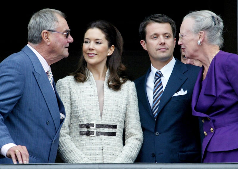 Crown Prince Frederik and his fiancee Mary Donaldson speak with Queen Margrethe and Prince Henrik as they appear on the balcony of the Christian IX Palace in Copenhagen in 2003. AP
