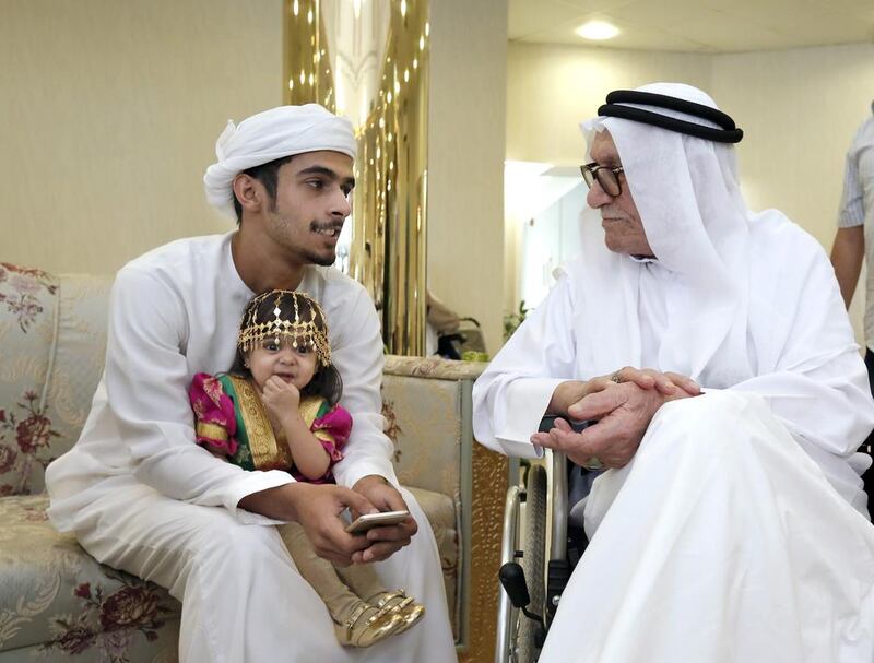 Friendships are forged across the generations in Sharjah as student volunteer Ali Al Baluoshi gets to know Abduljalil Ghanem. For the senior citizens, the visits bring companionship and conversation while the young enjoy perspectives on their nation’s past. Victor Besa for The National. 