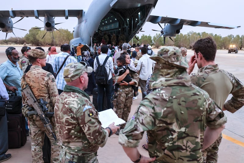 British citizens board an RAF aircraft at Wadi Saeedna airfield near Khartoum, Sudan. PA