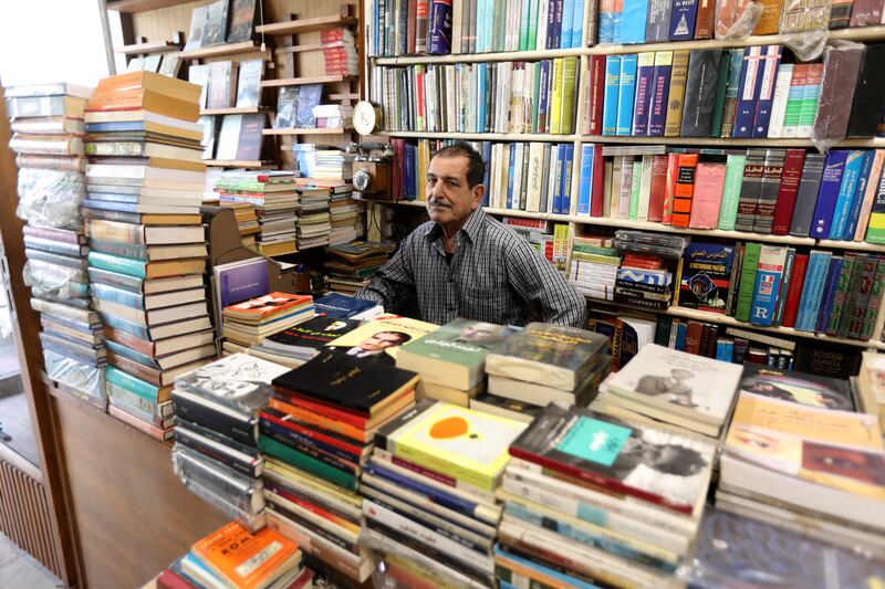 Owner Ali Hussein waits for customers at his bookshop named Al Nahda Al Arabiya Library, or Arab Renaissance Library, in central Baghdad. All photos: EPA