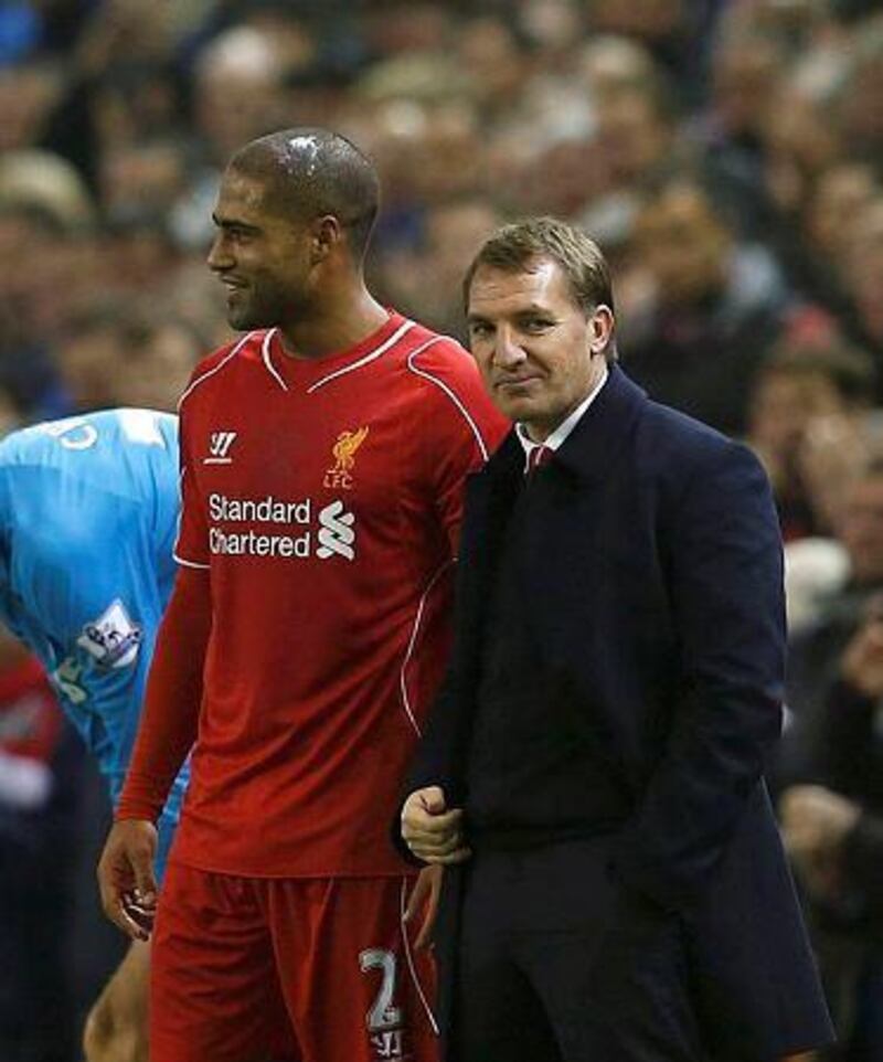 Liverpool manager Brendan Rodgers, right, stands next to goalscorer Glen Johnson during their English Premier League soccer match against Stoke City at Anfield in Liverpool, northern England November 29, 2014. REUTERS/Phil Noble