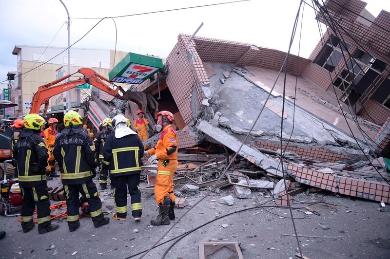 The rescue operation at a convenience store in Yuli that collapsed, trapping two people, who were saved. AP