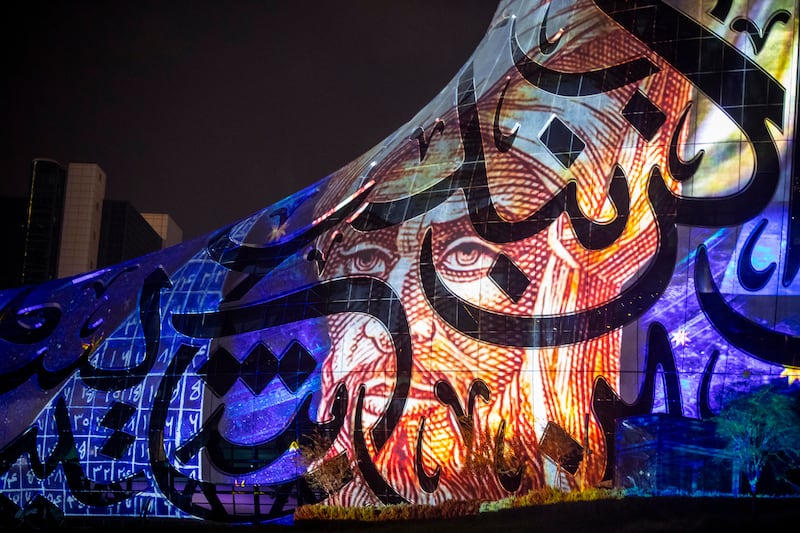 The illuminated calligraphy by Emirati artist Mattar bin Lahej covers the curved structure. Antonie Robertson / The National