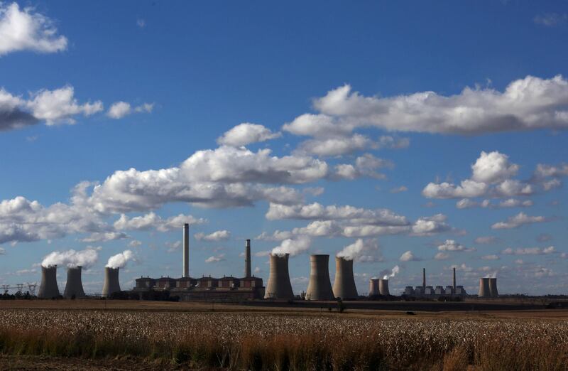 FILE PHOTO: Steam rises from the cooling towers of Matla Power Station, a coal-fired power plant operated by Eskom in Mpumalanga province, South Africa, May 20, 2018. REUTERS/Siphiwe Sibeko/File Photo