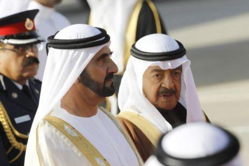 UAE Vice President and Prime Minister and Ruler of Dubai Sheikh Mohammed bin Rashid Al Maktoum is received by Bahraini prime minister Prince Khalifa bin Salman as he arrives for the GCC summit.