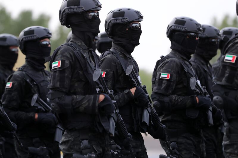Members of the security forces take part in a display.