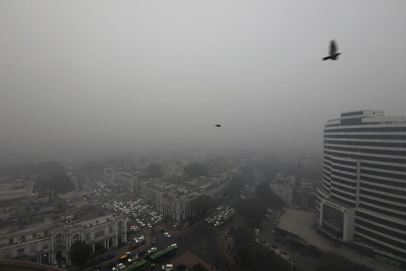 A thick layer of fog engulfs city sky line in New Delhi, India, Monday, Dec. 30, 2019.. The Indian capital which is witnessing the longest spell of cold weather in the last 22 years, woke up to a blanket of dense fog disrupting rail, road and air traffic adversely. (AP Photo/Manish Swarup)