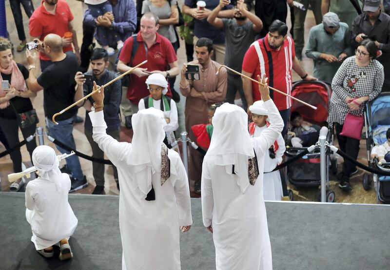 Dubai, United Arab Emirates - December 02, 2018: Traditional Emirati dancing performed on stage at MOE. Sunday the 2nd of December 2018 at Mall of the Emirates, Dubai. Chris Whiteoak / The National