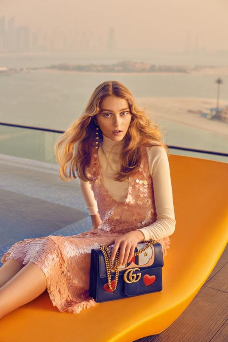 Daydreamer: Dress and top, Dh4,600, Dima Ayad. Bag, Dh12,950, Gucci. Earrings, Dh3,000, Gucci