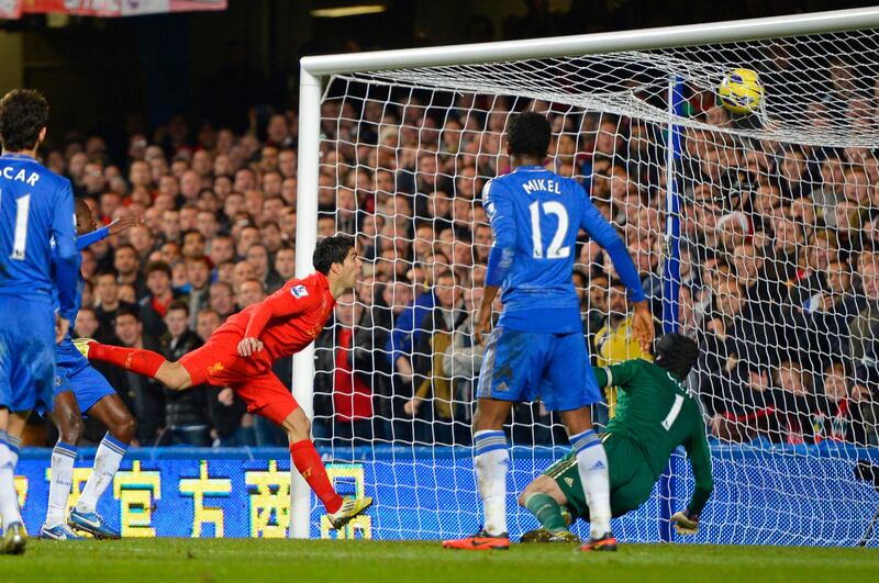 Liverpool's Luis Suarez (back L) scores against Chelsea during their English Premier League soccer match at Stamford Bridge Stadium in London, November 11, 2012. REUTERS/Russell Cheyne (BRITAIN - Tags: SPORT SOCCER TPX IMAGES OF THE DAY) NO USE WITH UNAUTHORIZED AUDIO, VIDEO, DATA, FIXTURE LISTS, CLUB/LEAGUE LOGOS OR "LIVE" SERVICES. ONLINE IN-MATCH USE LIMITED TO 45 IMAGES, NO VIDEO EMULATION. NO USE IN BETTING, GAMES OR SINGLE CLUB/LEAGUE/PLAYER PUBLICATIONS. FOR EDITORIAL USE ONLY. NOT FOR SALE FOR MARKETING OR ADVERTISING CAMPAIGNS *** Local Caption ***  CRC08_SOCCER-ENGLAN_1111_11.JPG