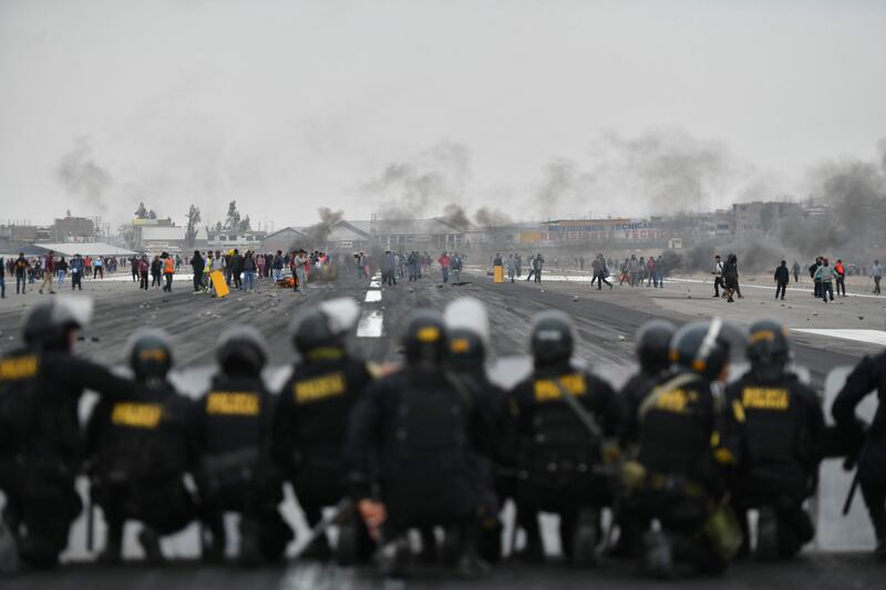 Protestors demonstrate against new Peru President Dina Boluarte at the airport in Arequipa on December 12. AFP