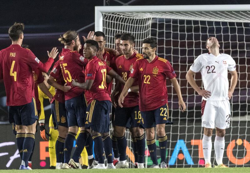 Spain's players celebrate after taking the lead during the UEFA Nations League match against Switzerland at the Alfredo Di Stefano Stadium in Madrid. EPA