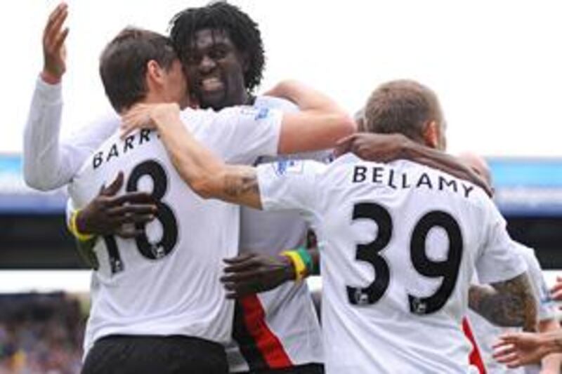 Emmanuel Adebayor, centre, celebrates his winning goal, his third in three games, against Portsmouth yesterday.