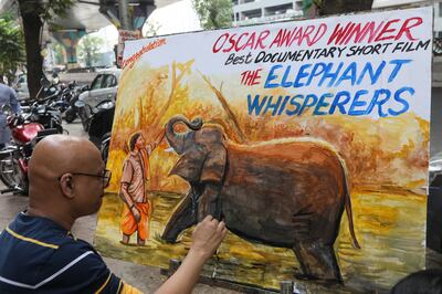 An Indian artist from Gurukul School of Art paints a tribute to Oscar-winning documentary 'The Elephant Whisperers'. EPA